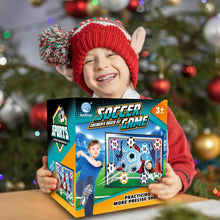 Load image into Gallery viewer, Child holding a soccer game box in front of a Christmas tree